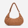 A Mocha brown puffer shoulder croissant bag by dude & bestie
