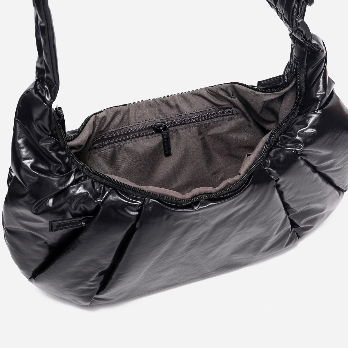 A black shiny Croissant-shaped shoulder bag with a single strap in polish black color