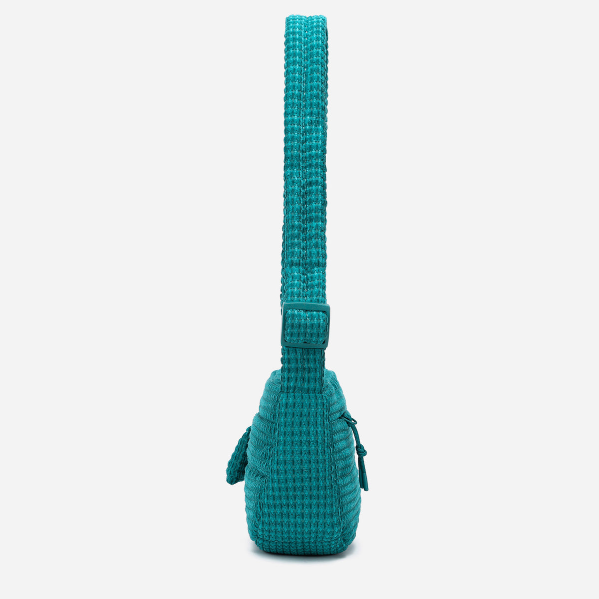 A teal woven corduroy shoulder bag by Dude & Bestie Winter 2026 Series