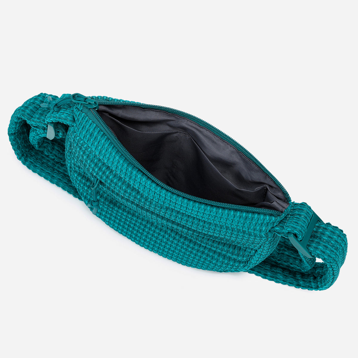 A teal woven corduroy shoulder bag by Dude & Bestie Winter 2026 Series