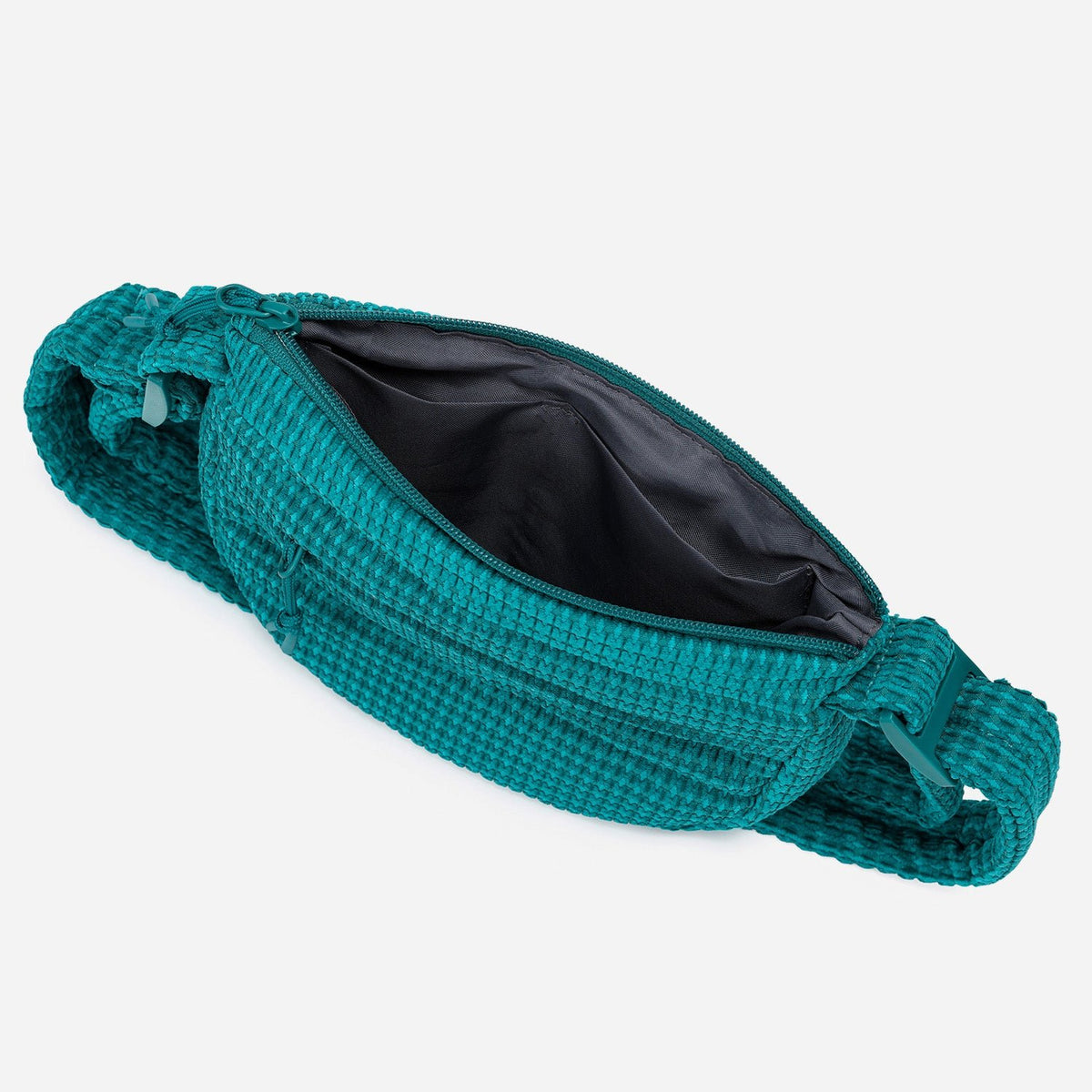 A teal woven corduroy shoulder bag by Dude & Bestie Winter 2026 Series